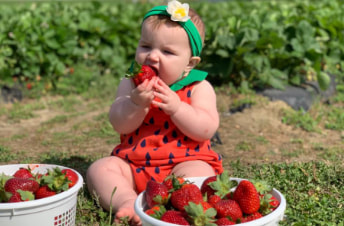 Baby's first strawberry at DJ's